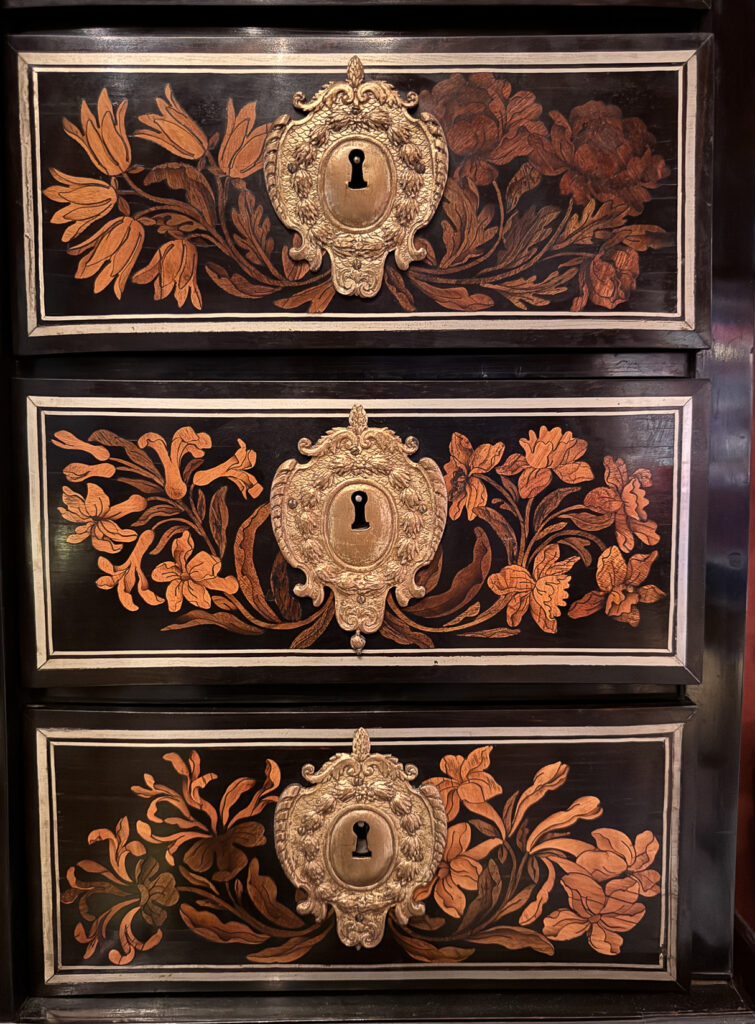 Detail of a case in early style of Charles Andre Boulle, following the Dutch tradition of pictorial marquetry