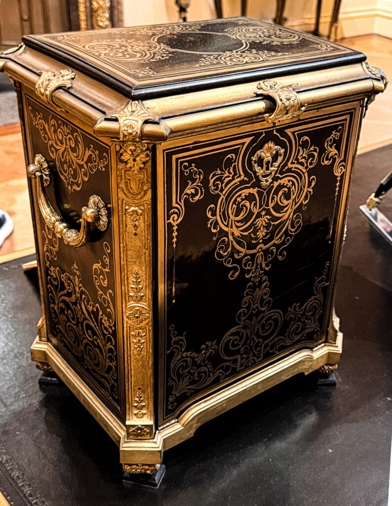 A clock case attributed to Charles Andre Boulle, 18th century French with heavy ormolu detail and brass and ebony marquetry