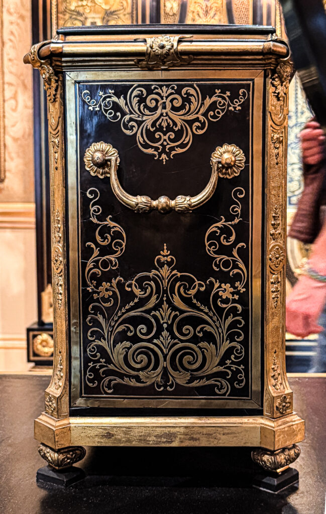 A clock case attributed to Charles Andre Boulle, 18th century French with heavy ormolu detail and brass and ebony marquetry