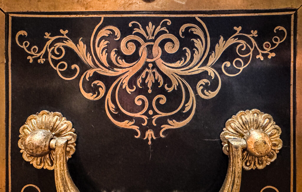 Detail of a clock case attributed to Charles Andre Boulle, 18th century French with heavy ormolu detail and brass and ebony marquetry